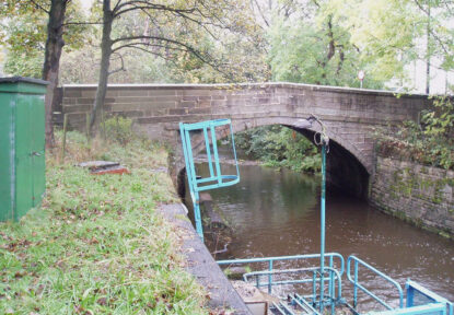 The stone arch beneath the Unsliven Old Bridge in Stocksbridge, Sheffield, UK